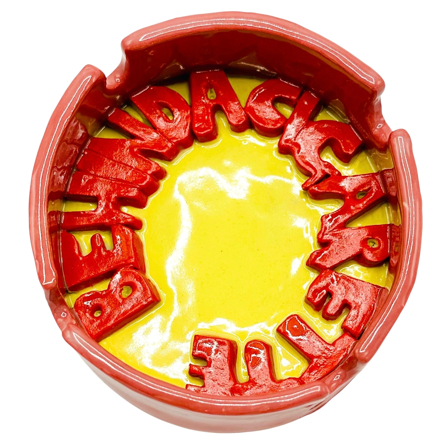 Behind A Cigarette Ashtray